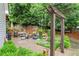 A backyard featuring a lush lawn, stone patio, fire pit, and pergola, creating an ideal outdoor living space at 1540 Kinglet Ln, Marietta, GA 30062