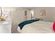 Bedroom featuring a large bed with white comforter and view of closet at 1540 Kinglet Ln, Marietta, GA 30062