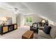 Bonus room with sofa, armchair and natural light at 1540 Kinglet Ln, Marietta, GA 30062