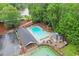 Community pool with lounge chairs, umbrellas, tennis courts, and a parking lot for convenient access at 1540 Kinglet Ln, Marietta, GA 30062