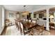 Dining room with a large wood table, decorative lighting, and columns at 1540 Kinglet Ln, Marietta, GA 30062