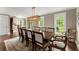 Dining room with long wooden table, seating for ten, and lots of natural light at 1540 Kinglet Ln, Marietta, GA 30062