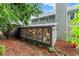 Rear view of the home with a sunroom, and lush landscaping adding to its charm and curb appeal at 1540 Kinglet Ln, Marietta, GA 30062