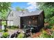 Exterior of home with screened-in porch, outdoor kitchen, and patio area ideal for entertaining at 1540 Kinglet Ln, Marietta, GA 30062