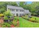 Charming two-story home with a manicured front lawn and colorful landscaping, creating a welcoming ambiance at 1540 Kinglet Ln, Marietta, GA 30062