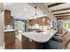 Bright kitchen with quartz countertops, stainless appliances, and wood beam accents at 1540 Kinglet Ln, Marietta, GA 30062