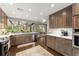 Spacious kitchen features stainless appliances, sleek countertops, and wood cabinets with backyard views at 1540 Kinglet Ln, Marietta, GA 30062