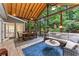 Cozy screened-in porch with outdoor dining and seating, perfect for relaxation and entertaining at 1540 Kinglet Ln, Marietta, GA 30062