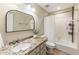 Updated bathroom with granite countertops, white tile backsplash, and shower-tub combination at 171 North Trce, Alpharetta, GA 30009