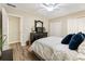 Bedroom with hardwood floors, ceiling fan, and natural light from the large window at 171 North Trce, Alpharetta, GA 30009