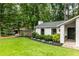 Welcoming home exterior with lush landscaping, a charming entryway, and a well-manicured front lawn at 171 North Trce, Alpharetta, GA 30009