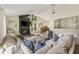 Bright living room features a stone fireplace, vaulted ceilings, large windows, and a comfortable sectional sofa at 171 North Trce, Alpharetta, GA 30009