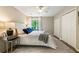 Main bedroom with wood flooring, neutral paint, a ceiling fan, and views of the backyard at 171 North Trce, Alpharetta, GA 30009