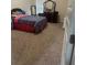 Cozy bedroom with dark wood dresser, patterned bedding, and plush carpet, great for relaxation at 1749 Misselthrush Ln, Mcdonough, GA 30253