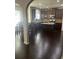 Modern kitchen with wood floors, stainless appliances, stone countertops and island at 1749 Misselthrush Ln, Mcdonough, GA 30253