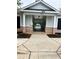 Inviting gated community pool entrance with brick accents and mature landscaping, perfect for a refreshing swim at 1749 Misselthrush Ln, Mcdonough, GA 30253