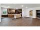 Partially finished basement with dark cabinets, tile flooring, and modern lighting at 2153 Cooper Lake Se Rd, Smyrna, GA 30080
