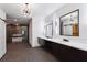 Modern bathroom featuring double vanity, marble countertops, designer lighting, and sleek mirrors at 2153 Cooper Lake Se Rd, Smyrna, GA 30080