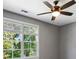 Comfortable bedroom with a ceiling fan and large window offering plenty of natural light at 2153 Cooper Lake Se Rd, Smyrna, GA 30080