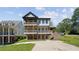 Multi-story home with a backyard porch and a well maintained lawn at 2153 Cooper Lake Se Rd, Smyrna, GA 30080