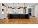Spacious kitchen with a large center island, custom cabinets, and modern pendant lighting at 2153 Cooper Lake Se Rd, Smyrna, GA 30080