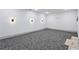 A spacious room with carpet flooring and modern lighting features at 2153 Cooper Lake Se Rd, Smyrna, GA 30080