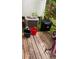 Untidy wooden back deck with trash can, A/C unit, and bicycle needing clean up at 3604 Ginnis Sw Rd # 4, Atlanta, GA 30331