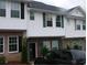 Attractive multi-level home featuring vinyl siding, brick accents, and black shutters on a cloudy day at 3604 Ginnis Sw Rd # 4, Atlanta, GA 30331