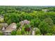 Sprawling brick estate surrounded by lush greenery, featuring a circular driveway and a swimming pool at 1858 Preserve Way, Atlanta, GA 30341