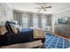 Serene bedroom with blue accents, plush bedding, and a large window at 1858 Preserve Way, Atlanta, GA 30341