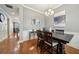Open dining room with hardwood floors, decorative light fixture, and stylish furniture at 1858 Preserve Way, Atlanta, GA 30341