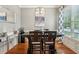 Elegant dining room with hardwood floors, modern light fixture, and stylish decor at 1858 Preserve Way, Atlanta, GA 30341