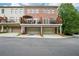 Charming brick townhome with a two-car garage and private balconies on the upper level at 1858 Preserve Way, Atlanta, GA 30341