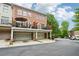 Brick townhome with two-car garage and upper level balconies, blending suburban charm with practical living at 1858 Preserve Way, Atlanta, GA 30341