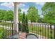 Outdoor porch with black wrought iron railings and seating with a street view at 1858 Preserve Way, Atlanta, GA 30341