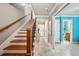 Staircase with wood treads, a carpet runner, and a decorative banister at 1858 Preserve Way, Atlanta, GA 30341