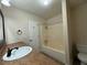 Full bathroom including a tub, shower, toilet and vanity at 3722 Cherokee Overlook Dr, Canton, GA 30115