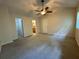 Bedroom with neutral carpet, vaulted ceiling, fan and ensuite bath at 3722 Cherokee Overlook Dr, Canton, GA 30115