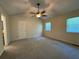 Bright bedroom with vaulted ceilings, neutral paint, carpet, and natural light from large windows at 3722 Cherokee Overlook Dr, Canton, GA 30115