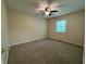 Bedroom with ceiling fan, carpeted floors, and natural light at 3722 Cherokee Overlook Dr, Canton, GA 30115