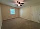 Bedroom features carpeted floors and natural light from a window at 3722 Cherokee Overlook Dr, Canton, GA 30115