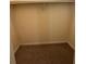 A carpeted closet with a clothes rod provides storage at 3722 Cherokee Overlook Dr, Canton, GA 30115