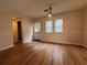 Dining area with wood floors, windows, neutral paint, and an exterior door to the backyard at 3722 Cherokee Overlook Dr, Canton, GA 30115