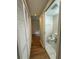 Hallway with access to a half bath and closet space at 3722 Cherokee Overlook Dr, Canton, GA 30115