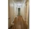 Hallway with hardwood floors leads to multiple rooms at 3722 Cherokee Overlook Dr, Canton, GA 30115