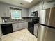Modern kitchen with stainless steel appliances and granite countertops at 3722 Cherokee Overlook Dr, Canton, GA 30115