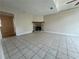 Spacious living room featuring tile flooring and a beautiful stone fireplace at 3722 Cherokee Overlook Dr, Canton, GA 30115