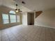 Inviting living room with tile flooring, a ceiling fan, and large windows at 3722 Cherokee Overlook Dr, Canton, GA 30115