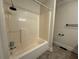 Full bath with a shower and tub combination with chrome shower head and faucet at 3722 Cherokee Overlook Dr, Canton, GA 30115