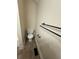 Toilet with dark metal towel rack and tiled floor at 3722 Cherokee Overlook Dr, Canton, GA 30115